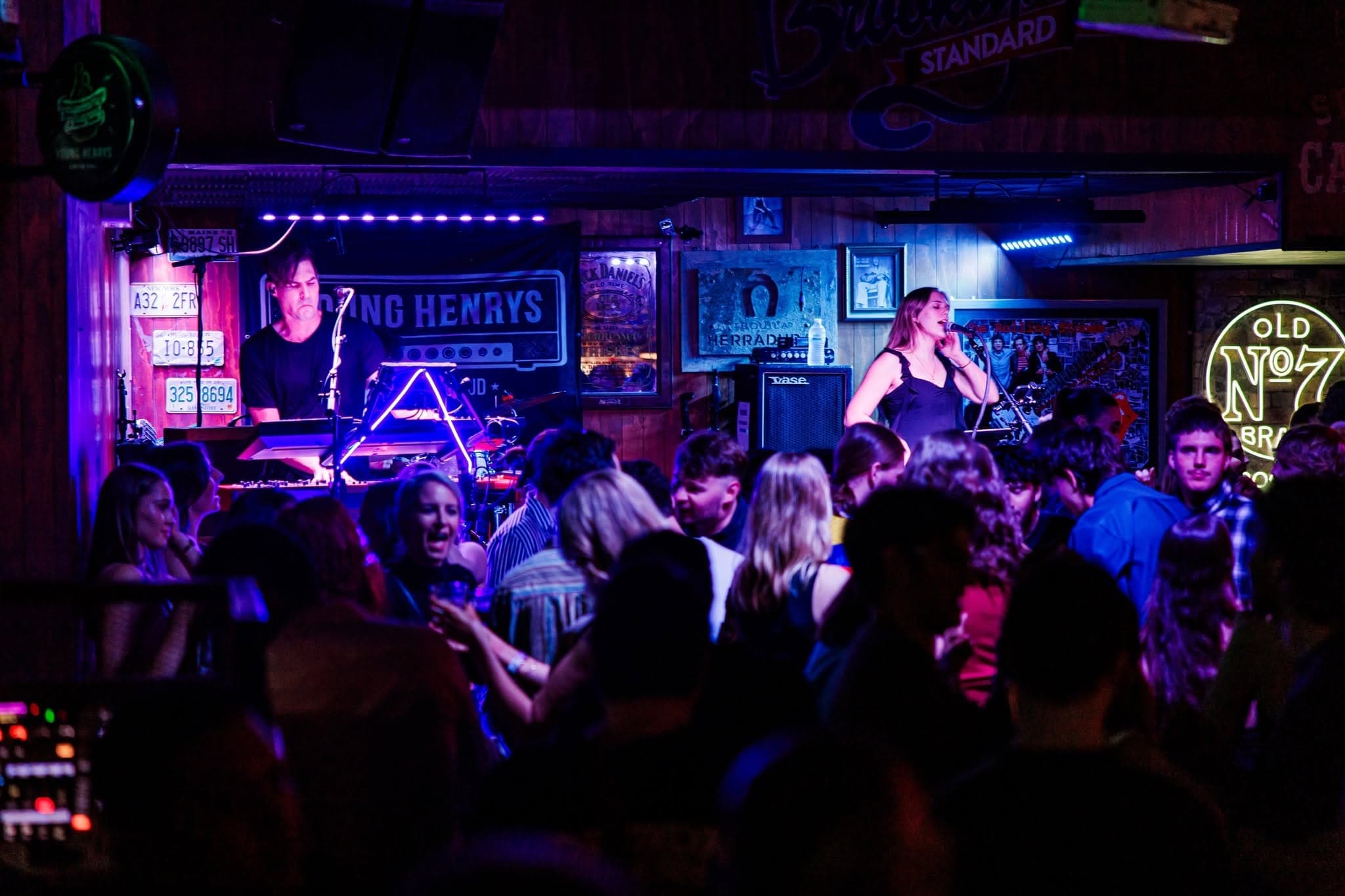 Singer and band with a full dance floor